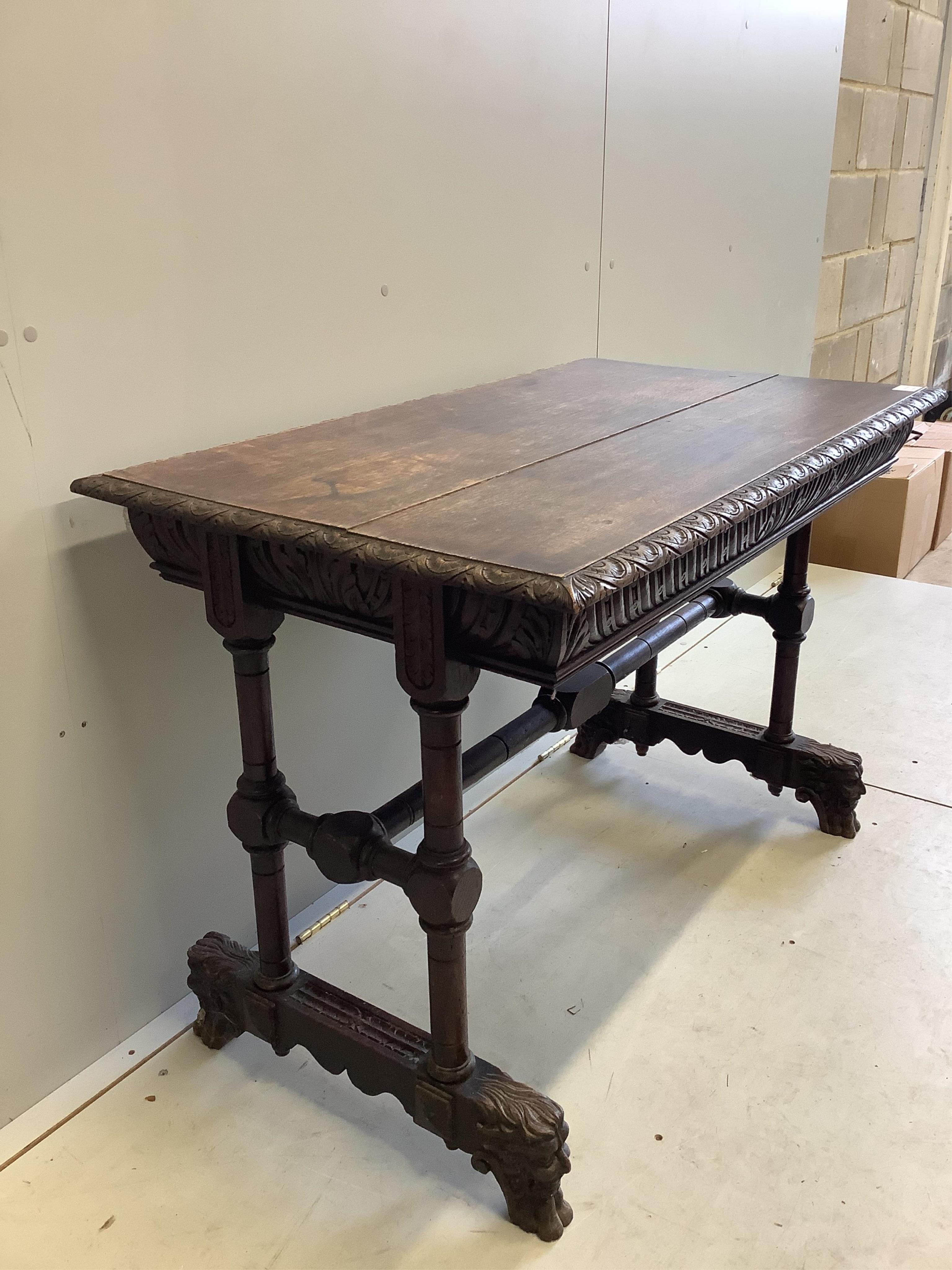 A late Victorian Flemish carved oak side table, width 108cm, depth 62cm, height 75cm. Condition - fair